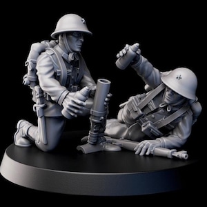 May include: A gray miniature sculpture of two soldiers in military uniforms, one kneeling and the other lying down. They are positioned around a mortar, with helmets and backpacks. The sculpture is on a black circular base.