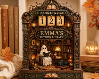 Könnte beinhalten: Ein dekorativer Tischkalender mit einer gewölbten Bibliotheksszene, einem lesenden Geist im Sessel, einer schwarzen Katze und Bücherregalen. Der Text lautet BOOKS THIS YEAR und EMMA'S AUTUMN LIBRARY. Die Struktur ist mit Herbstblättern verziert.