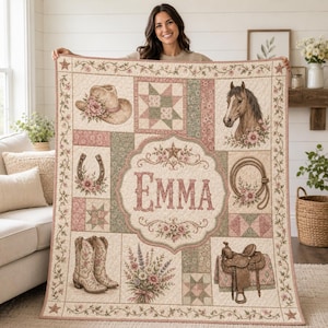 May include: A rectangular quilt featuring a cream background with a patchwork design of floral and geometric patterns. The quilt displays a cowboy hat, a horse head, a horseshoe, a lasso, cowboy boots, a saddle, and a bouquet of flowers. The name EMMA is printed in large, decorative serif letters in the center.