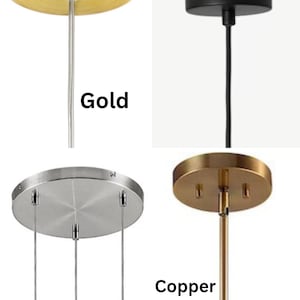 May include: Four pendant light fixtures in gold, black, silver, and copper finishes. Each fixture has a circular canopy and a single hanging wire or rod. The text labels each color.