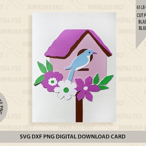 May include: A digital download card featuring a pink birdhouse with a blue bird perched on the edge. The birdhouse is surrounded by green leaves and purple and white flowers. The card is designed for cutting with a Cricut machine and includes instructions for the cut pressure, blade depth, and blade speed.