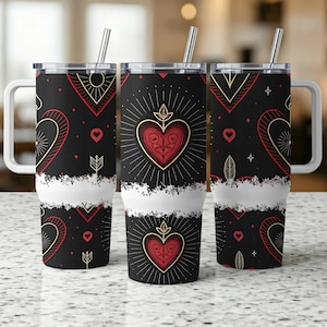 May include: Three black insulated tumblers with white handles and lids. Each tumbler features a repeating pattern of red hearts, arrows, and geometric shapes. A white band separates the black design from the bottom. Silver straws are inserted into the lids.