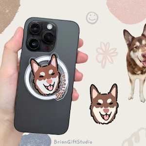 May include: A black phone case with a clear phone grip featuring a cartoon illustration of a brown and white dog with the name "Melissa" written on the grip.