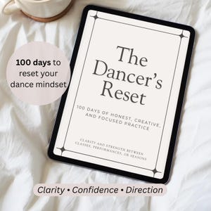 May include: A digital tablet displaying a document titled The Dancer's Reset, featuring the text 100 days of honest, creative, and focused practice, and clarity and strength between classes, performances, or seasons, with additional text overlays.