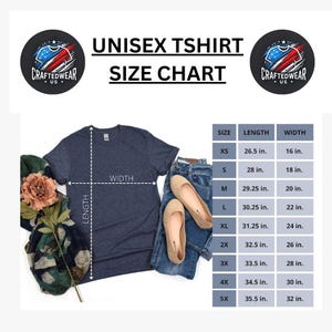 May include: A navy blue unisex t-shirt with a size chart. The chart shows measurements for sizes XS to 5X, with lengths ranging from 26.5 inches to 35.5 inches and widths from 16 inches to 32 inches. The image includes jeans and shoes.
