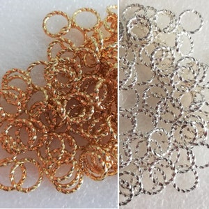 8mm Jump ring, Gold or Silver plated brass, twisted round, 16 gauge. Sold per pkg of 100(Jump-02)