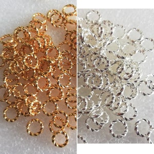 6mm Jump ring, Gold or Silver Plated brass, twisted round, 16 gauge. Sold per pkg of 100(Jump-01)