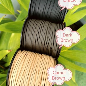 three spools of cord, each with a different color: black, dark brown, and camel brown. The spools are arranged in a row, with the black one at the top, the dark brown one in the middle, and the camel brown one at the bottom. Each spool is labeled with a speech bubble containing the name of the color, such as "Black", "Dark Brown", and "Camel Brown".