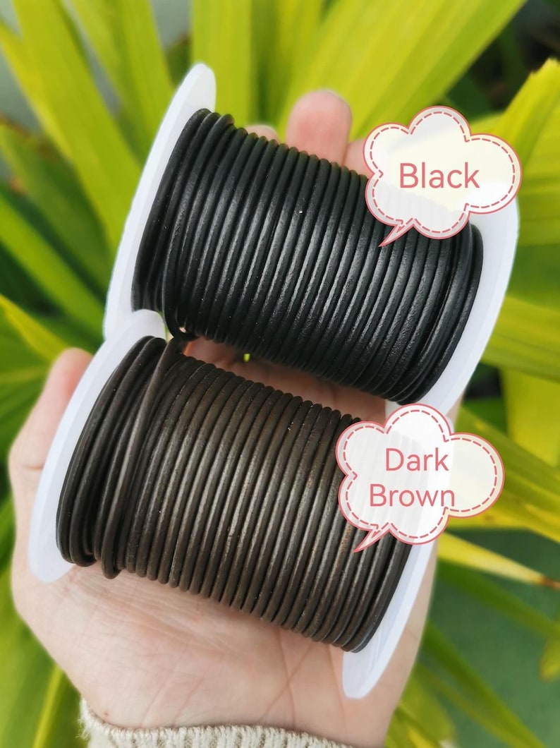 A hand holding two spools of black and brown leather cord, with speech bubbles indicating the color of each spool.