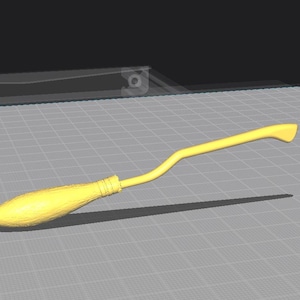 May include: A yellow broom with a curved handle and a brush-like end. The broom is set against a gray grid background with a dark shadow.