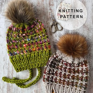 May include: Two hand-knitted hats with faux fur pom-poms. One is green with colourful flecks and ear flaps, the other is cream, brown, and red. The image includes scissors and a tag that says "KNITTING PATTERN".