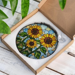 a stained glass sunflower is in a box