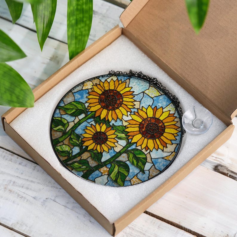 a stained glass sunflower is in a box