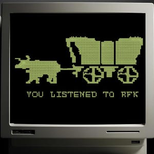 May include: A vintage computer monitor displays a pixelated image of a covered wagon pulled by a bear, with the text "YOU LISTENED TO RFK" in green on a black screen. A keyboard and computer tower are in the foreground.