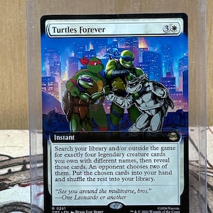 May include: A collectible card featuring the Teenage Mutant Ninja Turtles. The card art depicts the four turtles in a cityscape setting. The card title is "Turtles Forever" and includes game instructions and a quote.