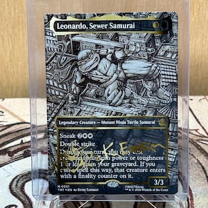 May include: A collectible card featuring Leonardo, Sewer Samurai, a Mutant Ninja Turtle. The card has a black and white illustration of Leonardo in action, with text describing its abilities. The card is in a protective sleeve.