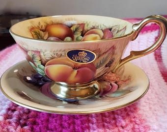Taza de té y platillo Aynsley Orchard Gold. Firmada. Vintage. Hecha en Inglaterra.
