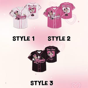 May include: Three baseball jerseys with Minnie Mouse designs. Style 1 is white with pink pinstripes, Style 2 is pink with white pinstripes, and Style 3 is black with pink pinstripes. Each jersey has a Minnie Mouse graphic and the word "Minnie". The back of each jersey has a Minnie Mouse graphic and the text "Your Name".