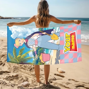 May include: A rectangular beach towel featuring a cartoon character with blonde hair wearing a blue outfit, holding a yellow shovel and a pink bucket on a beach background. The right side has a pink and blue checkerboard pattern with the text Your name.