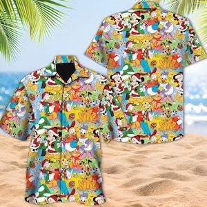 May include: A short-sleeved button-down shirt with a vibrant Christmas-themed design. The pattern showcases cartoon characters in Santa hats, gifts, and festive decorations. The shirt is presented on a sandy beach with a tropical backdrop.