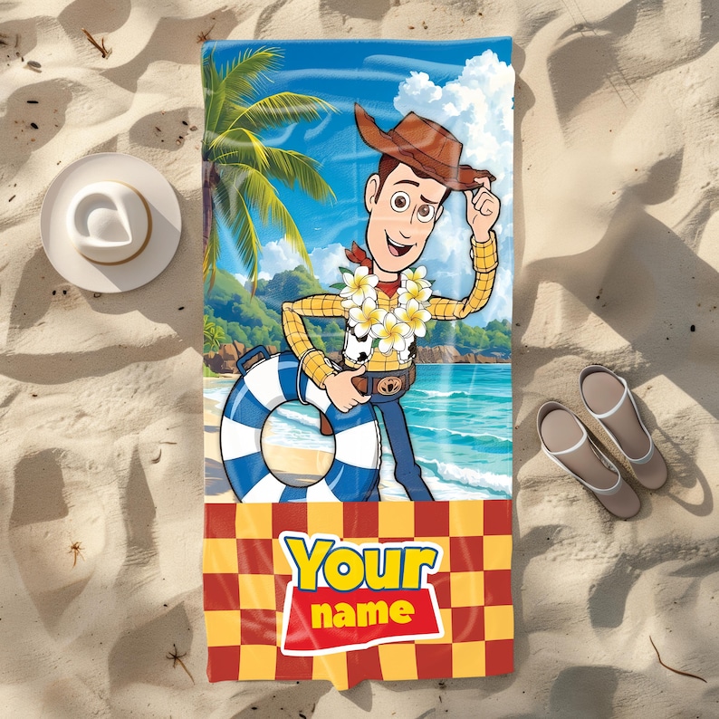 May include: A rectangular beach towel featuring a graphic of the character Woody from Toy Story wearing a lei and holding a blue and white striped life preserver on a tropical beach. The bottom section has a red and yellow checkerboard pattern with the text Your name.