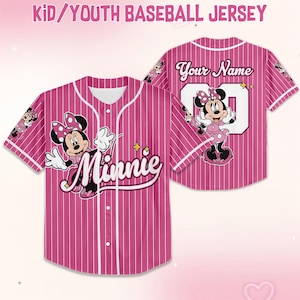 May include: Pink pinstripe youth baseball jersey featuring Minnie Mouse. The jersey has white accents, a button-up front, and the word "Minnie" in script. The back of the jersey has the text "Your Name" and the number "00".