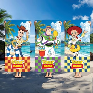 May include: Three rectangular beach towels featuring Toy Story characters Woody, Buzz Lightyear, and Jessie on a tropical beach background. Each towel has a checkered bottom section with the text Your name in a red and yellow logo style.