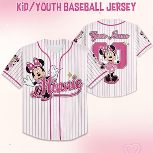 May include: White and pink pinstripe baseball jersey featuring Minnie Mouse. The front displays "Minnie" in pink script, while the back has "Your Name" above a pink number. The jersey is designed for kids and youth.