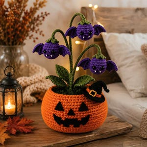 A Halloween-themed crochet pumpkin potted lamp, paired with a spooky ghost‑shaped bellflower night light