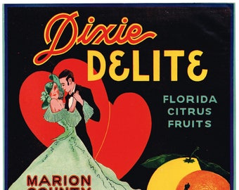 May include: A vintage citrus fruit label with a couple dancing in front of two red hearts. The label reads "Dixie Delite", "Florida Citrus Fruits", "Marion County Citrus Co.", and "Weirsdale, Florida".
