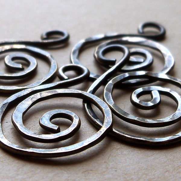Hammered antiqued brass spirals, four pieces