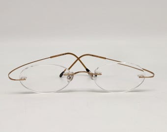 Montura de gafas sin aro Silhouette, fabricada en Austria, lentes en tono dorado, 20 6051 150