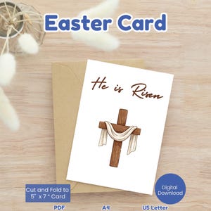Könnte beinhalten: Osterkarte mit dem Text "He is Risen" und einem Holzkreuz mit weißem Tuch. Die Karte liegt auf einem braunen Umschlag, mit Informationen zum digitalen Download und den Maßen von 12,7 cm x 17,8 cm im gefalteten Zustand.