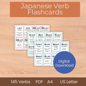 May include: Japanese verb flashcards with English translations. The flashcards are in a stack, with a blue circle that says "Digital Download". The background is a light wood grain.