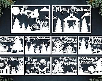 May include: A collection of white paper cutouts with Christmas themes. Designs include Santa in a sleigh, a nativity scene, Christmas trees, snowmen, and Santa Claus. Each cutout features the words "Merry Christmas".