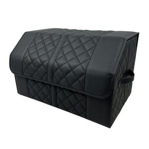 May include: Black car trunk organizer with a quilted diamond pattern. The organizer has a rectangular shape with a hinged lid and a handle on the side. The interior is not visible.