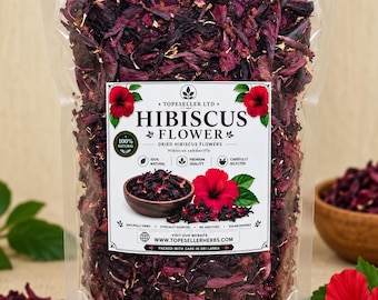 Può includere: Una busta in plastica trasparente riempita con fiori di ibisco essiccati rosso scuro. L'etichetta riporta il testo TOPESELLER LTD, HIBISCUS FLOWER, 100% NATURAL, PREMIUM QUALITY, CAREFULLY SELECTED e il sito web WWW.TOPESELLERHERBS.COM, con grafiche.