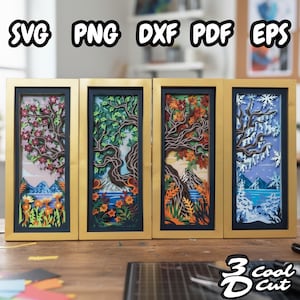 May include: Four framed paper art pieces showing seasonal trees. Each piece depicts a different season: spring blossoms, summer foliage, autumn leaves, and winter snow. The frames are gold with a dark blue interior, and the text "SVG PNG DXF PDF EPS" is at the top.