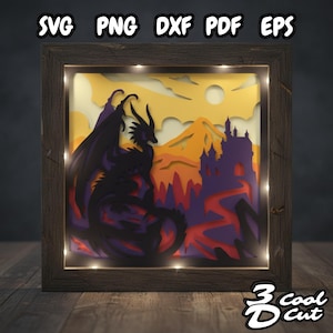 May include: A framed, layered paper art piece featuring a black dragon, castle, and mountains against a yellow and orange sky. The artwork is illuminated with small lights and includes the text "SVG PNG DXF PDF EPS" and "3 Cool Cut".