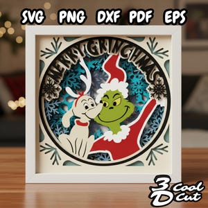 May include: A framed Christmas-themed paper art piece featuring the Grinch and Max. The artwork is layered with a white frame, and includes the text "MERRY GRINCHMAS" and the words "SVG PNG DXF PDF EPS".