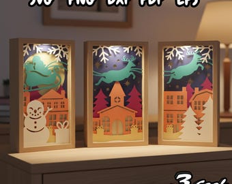 May include: Three illuminated Christmas-themed shadow boxes with wooden frames. Each box features a different winter scene: a snowman, a reindeer, and a sleigh. The boxes are lit from within, creating a warm glow. The text "SVG PNG DXF PDF EPS" is at the top.