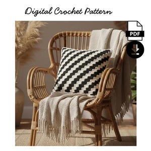 May include: A rattan chair with a black and white striped cushion and a fringed beige throw. The image includes the text "Digital Crochet Pattern" and a PDF download icon. The chair is in a neutral-toned setting.