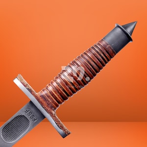 May include: A combat knife featuring a brown, ribbed leather-wrapped handle, a dark metal pommel with a pointed tip, and a silver-toned metal crossguard. The blade base is marked with the letters FSSF and features a textured oval grip section.