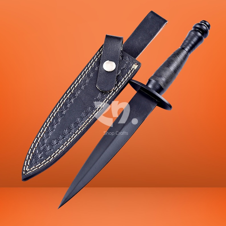 May include: A black double-edged dagger with a textured grip and a matching black leather sheath. The sheath features decorative embossed patterns, white stitching, and a snap button closure. The blade is pointed and finished in a matte black.