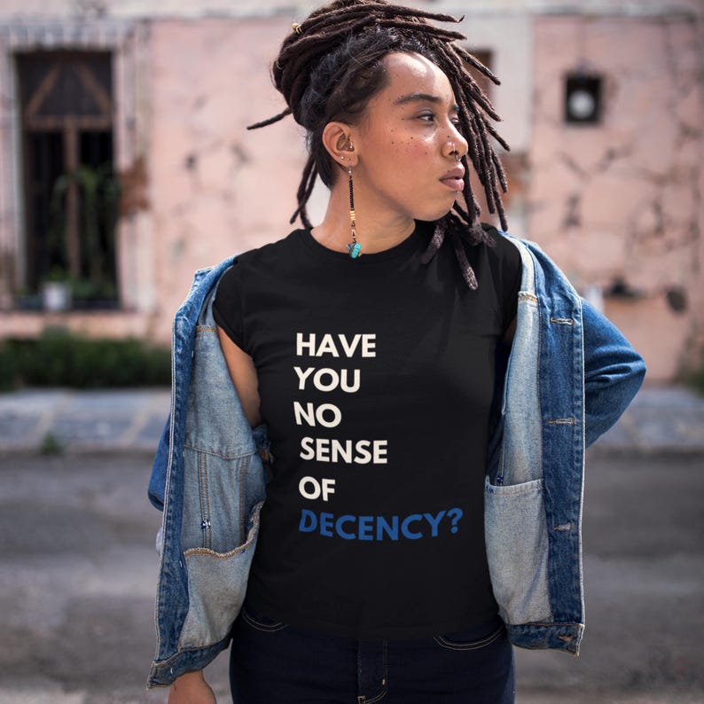 a woman with dreadlocks wearing a t - shirt that says have you no