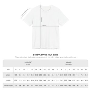 a white t-shirt with measurements and sizes listed below it.