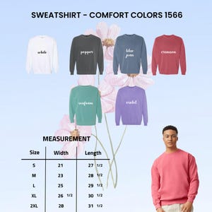 May include: A display of Comfort Colors sweatshirts in various colors, including white, pepper, blue jean, crimson, seafoam, and violet. The image also includes a size chart with measurements in inches for width and length, and a person wearing a crimson sweatshirt.