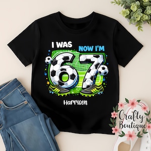 May include: Black t-shirt with a soccer design. The graphic shows the numbers "67" as footballs, with the text "I WAS NOW I'M" above and the name "Harrison" below. Includes football boots.