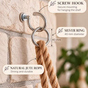 May include: A silver screw hook mounted to a wall, holding a silver ring with a 40 mm diameter. A natural jute rope is looped through the silver ring. Text labels indicate the screw hook for mounting, the 40 mm silver ring, and the jute rope.