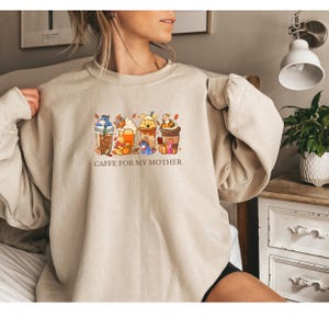 If coffee fuels your soul, this sweatshirt is made for you! Style meets your coffee love.Sip your coffee, wear your sweatshirt